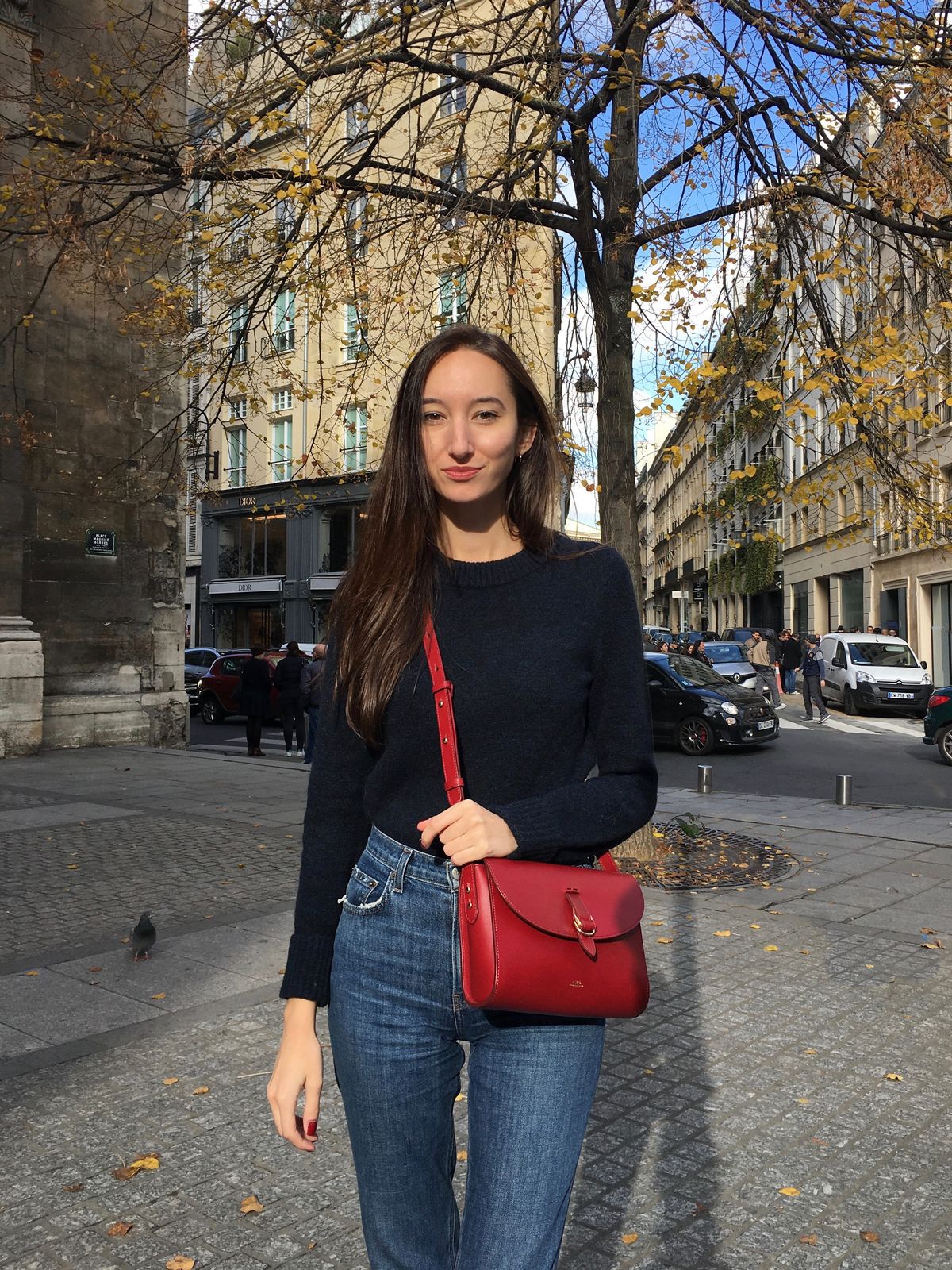 French Girl Accessories - APC leather crossbody bag, Reformation jeans, COS blue sweater