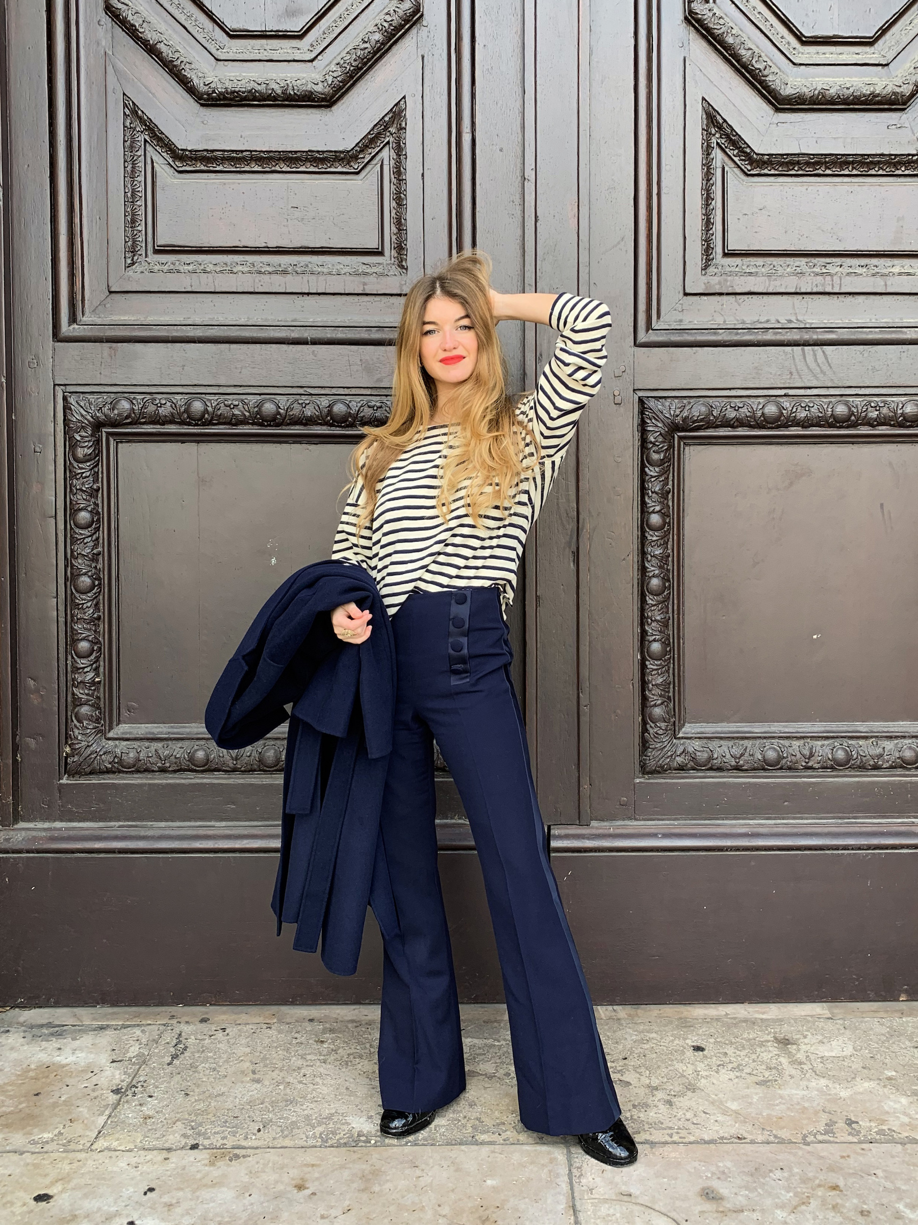 Constance Arnoult wearing high waisted navy pants in Paris