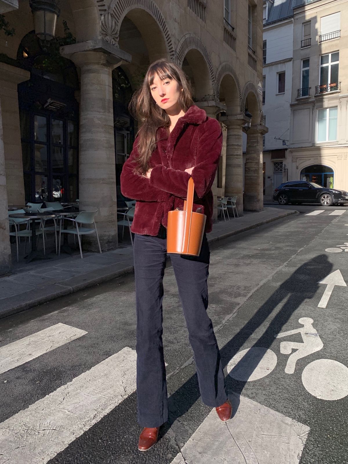 Parisian Winter Look: Bordeaux Faux Fur Jacket, Nathalie Dumeix Navy Joplin Pants, Brown Leather Staud Bissett Bucket Bag