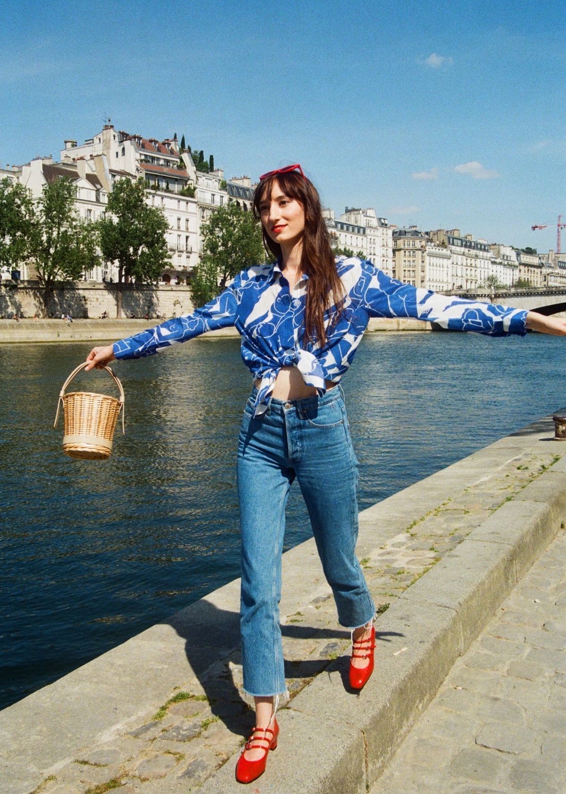 Victoria Petersen wearing Carel Kina Shoes, Fete Imperiale Silk Alice Shirt, Rouje jeans, Polene Wicker Bag, Rendel Sunglasses